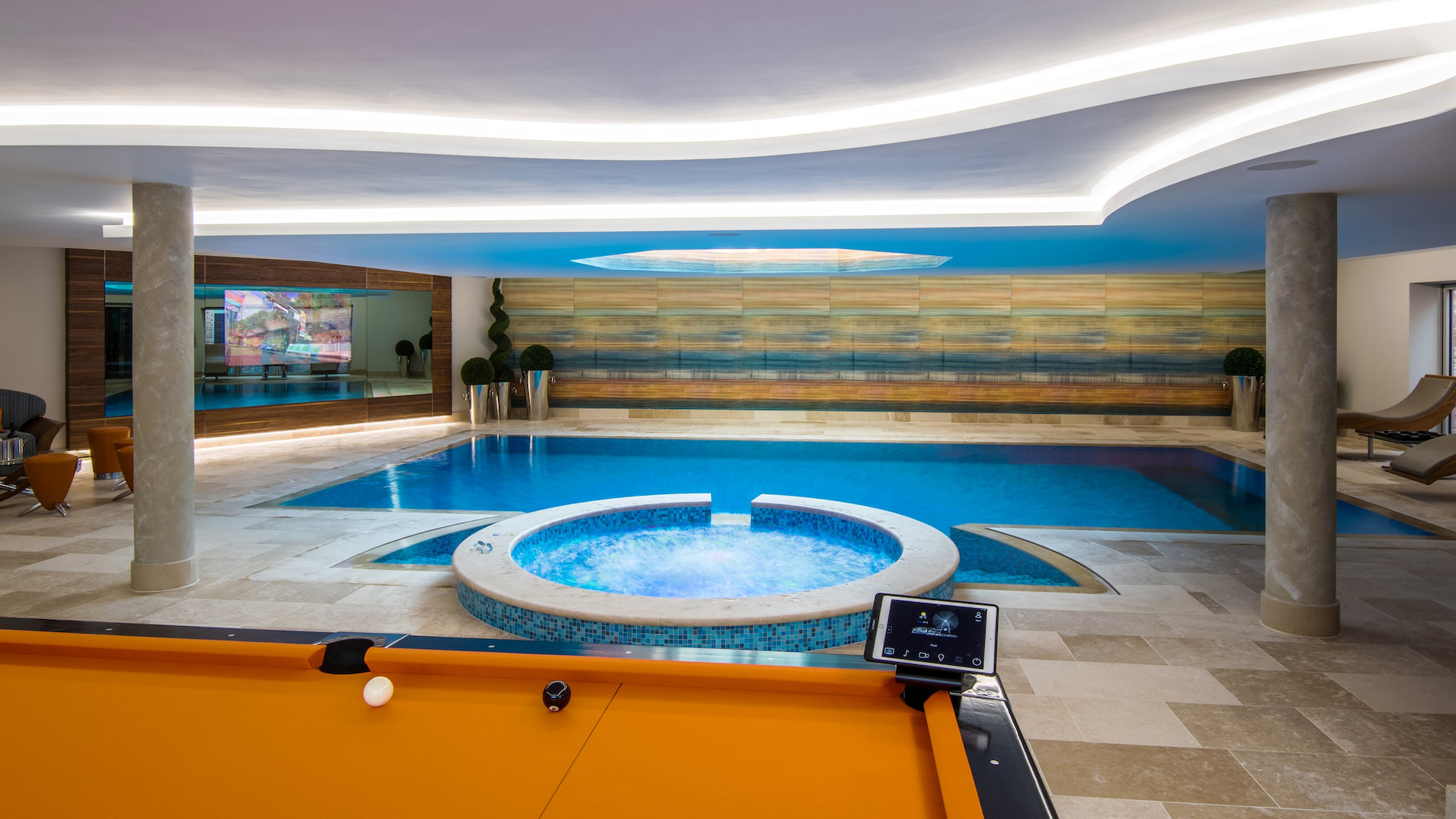 Indoor pool area with jacuzzi.